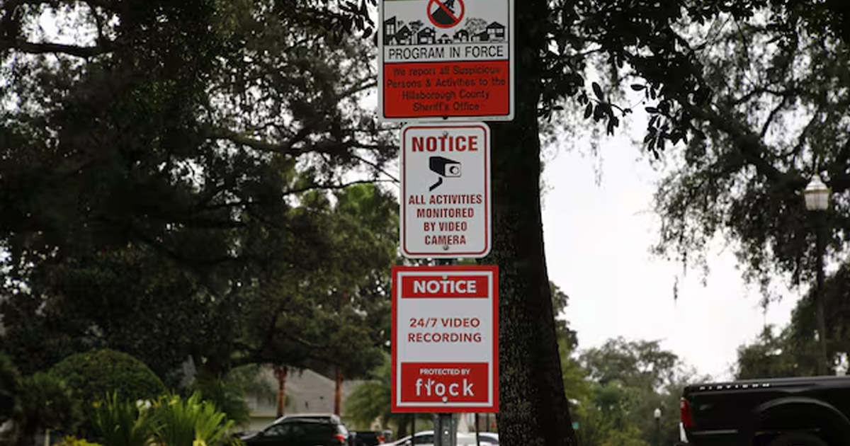 Flock surveillance camera on a suburban street