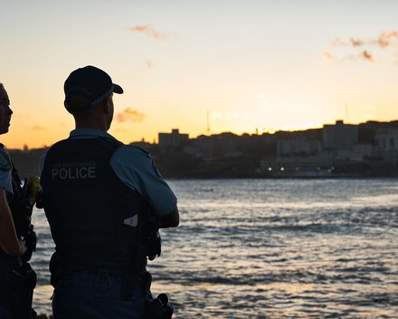 Australian police officers watching over the public at dusk