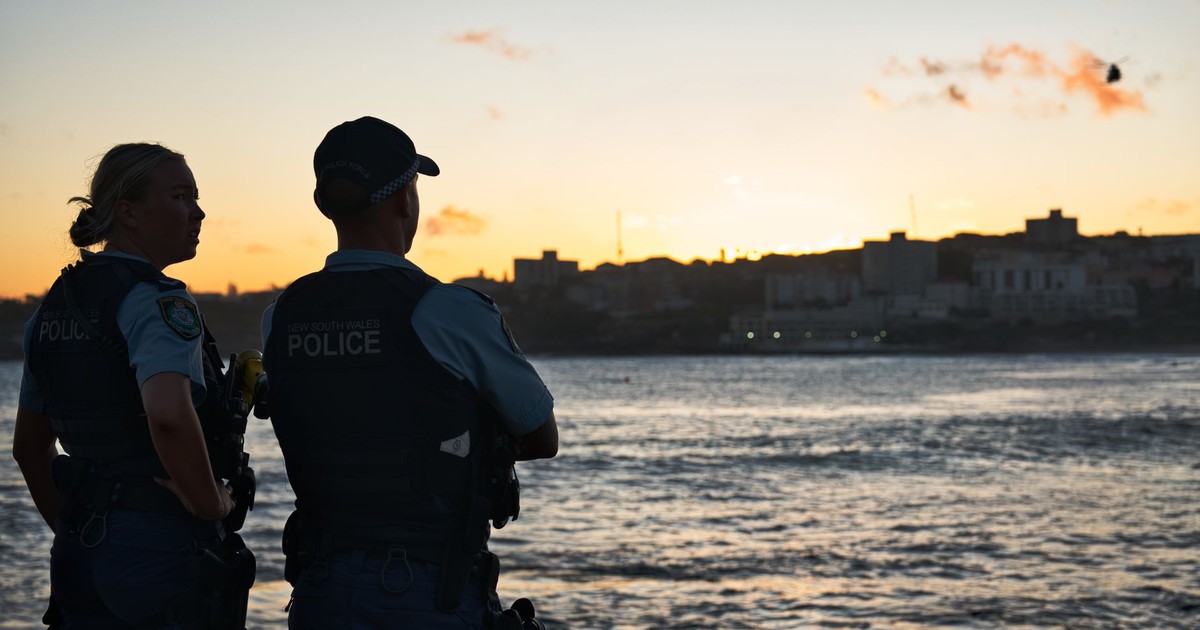 Australian police officers watching over the public at dusk
